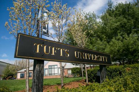 Tufts sign with flowers and trees