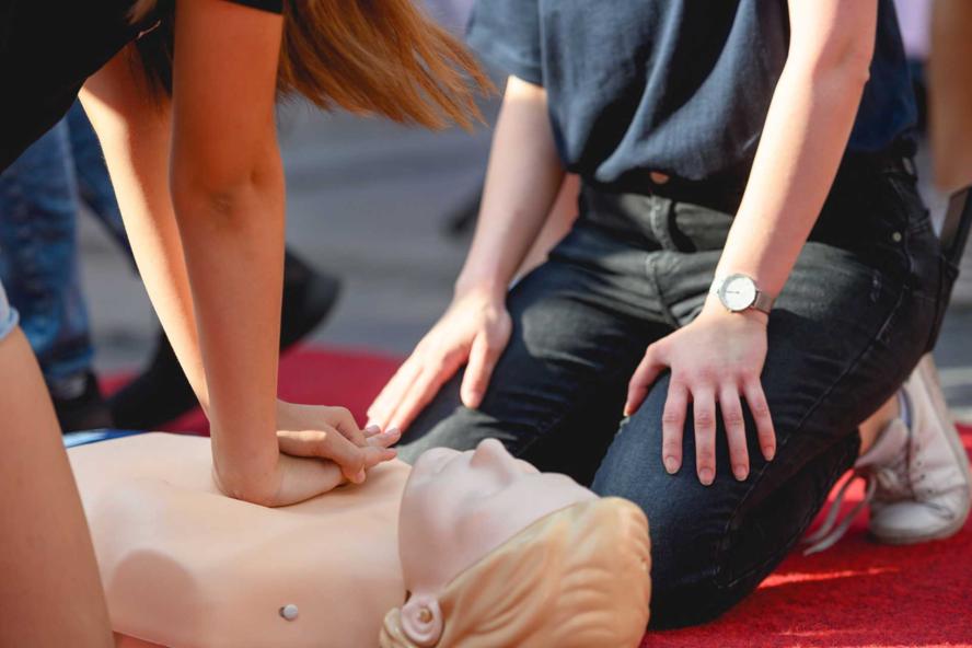 CPR training of people using CPR on a dummy